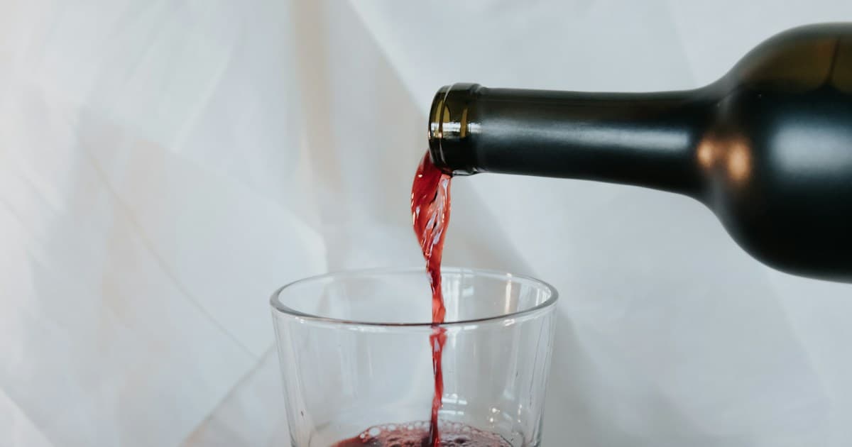 clear drinking glass with red liquid